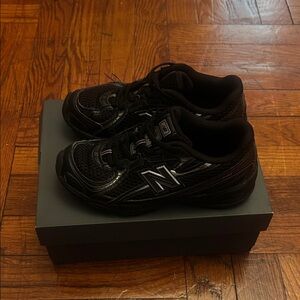 New Balance Kids Black Athletic Sneakers with Silver Logo